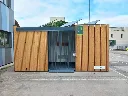 Abri vélo fermé en bois équipé de panneaux solaires chez Enedis